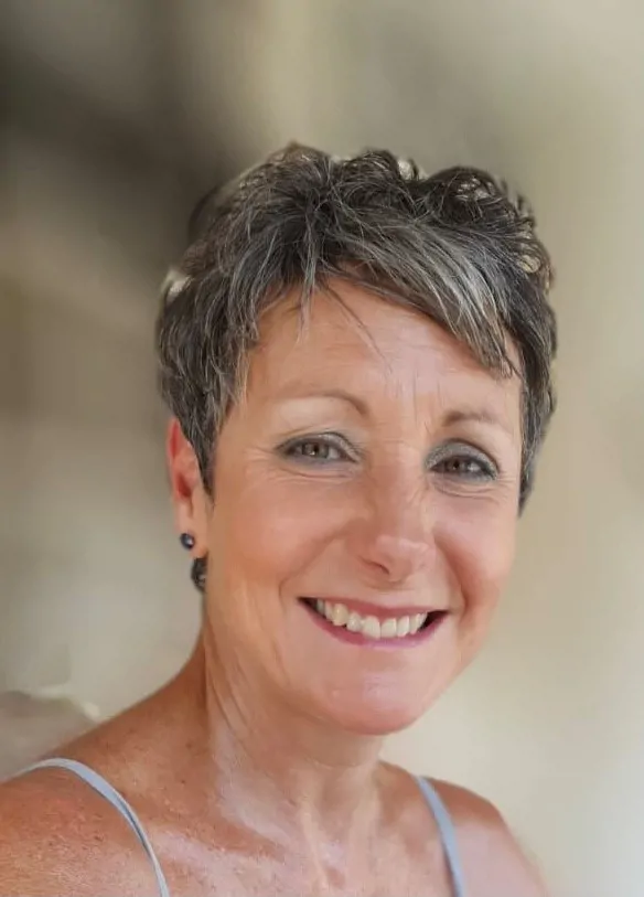 Portrait of a smiling woman in a neutral background